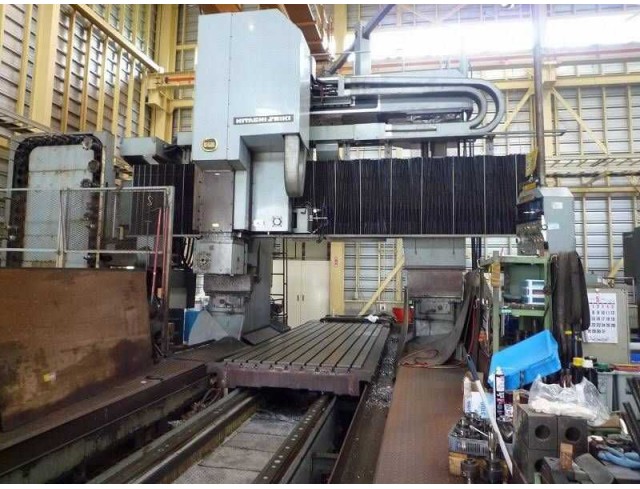 Hitachi Seiki CNC gate type five-face processing machine Model VE21-40 / 1989 made Control FANUC-11M (red motor) Machine number B-3327 Gate Width 2050 Table 1300 × 4000 Hitachi Seiki CNC gate type five-face processing machine Model VE21-40 / 1989 made Control FANUC-11M (red motor) Machine number B-3327 Gate Width 2050 Table 1300 × 4000